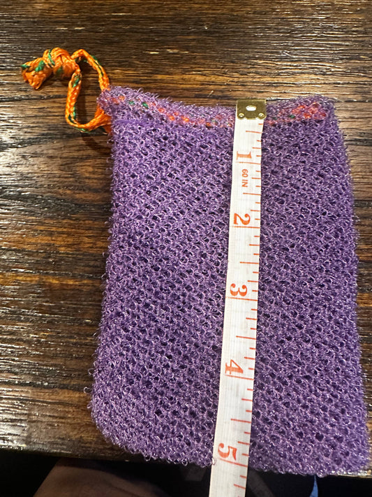 Fiori Essentials and Co purple authentic African net sponge soap saver with measuring tape on wooden surface