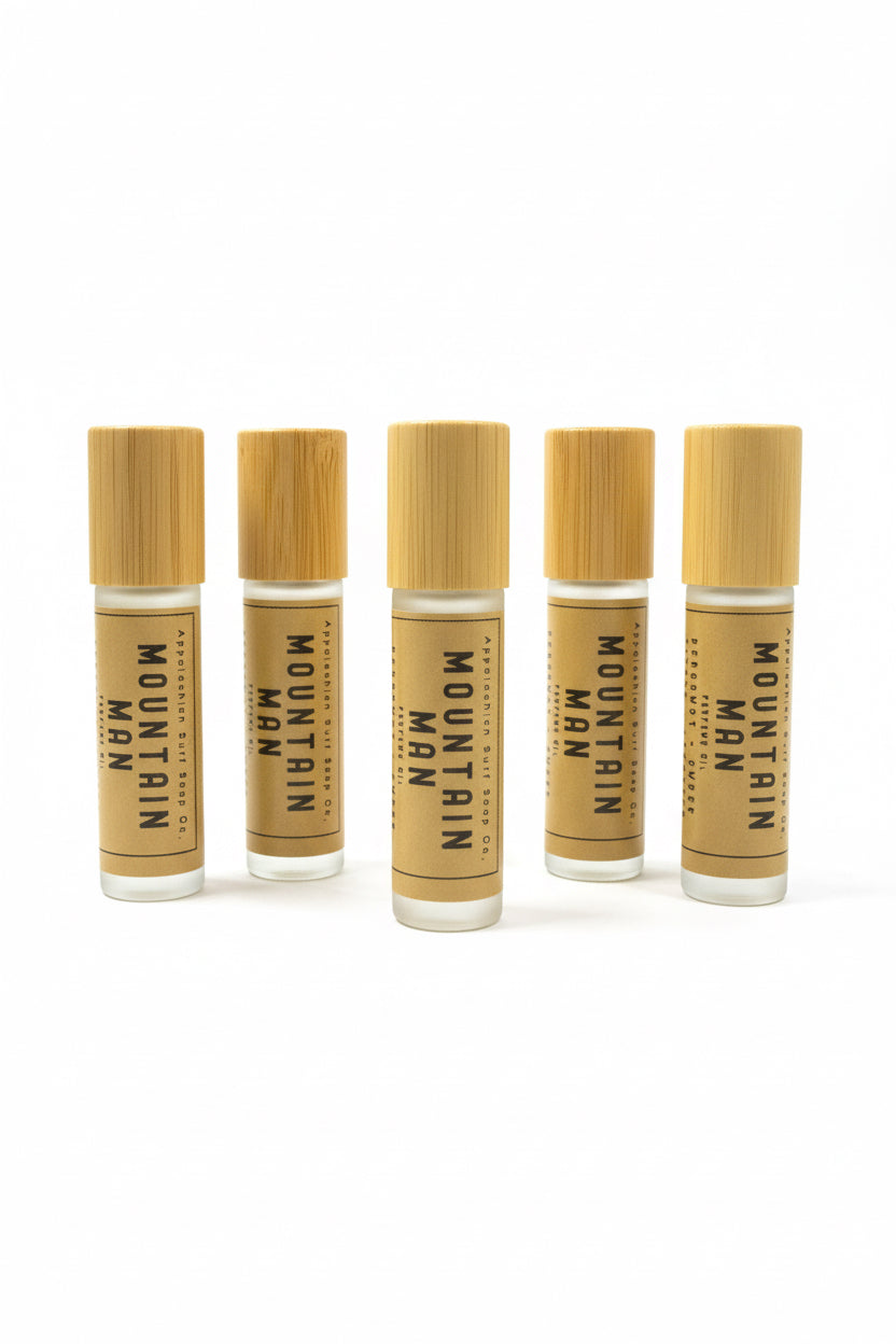 Five Appalachian Surf Soap Co Mountain Man perfume oil roller bottles with bamboo caps