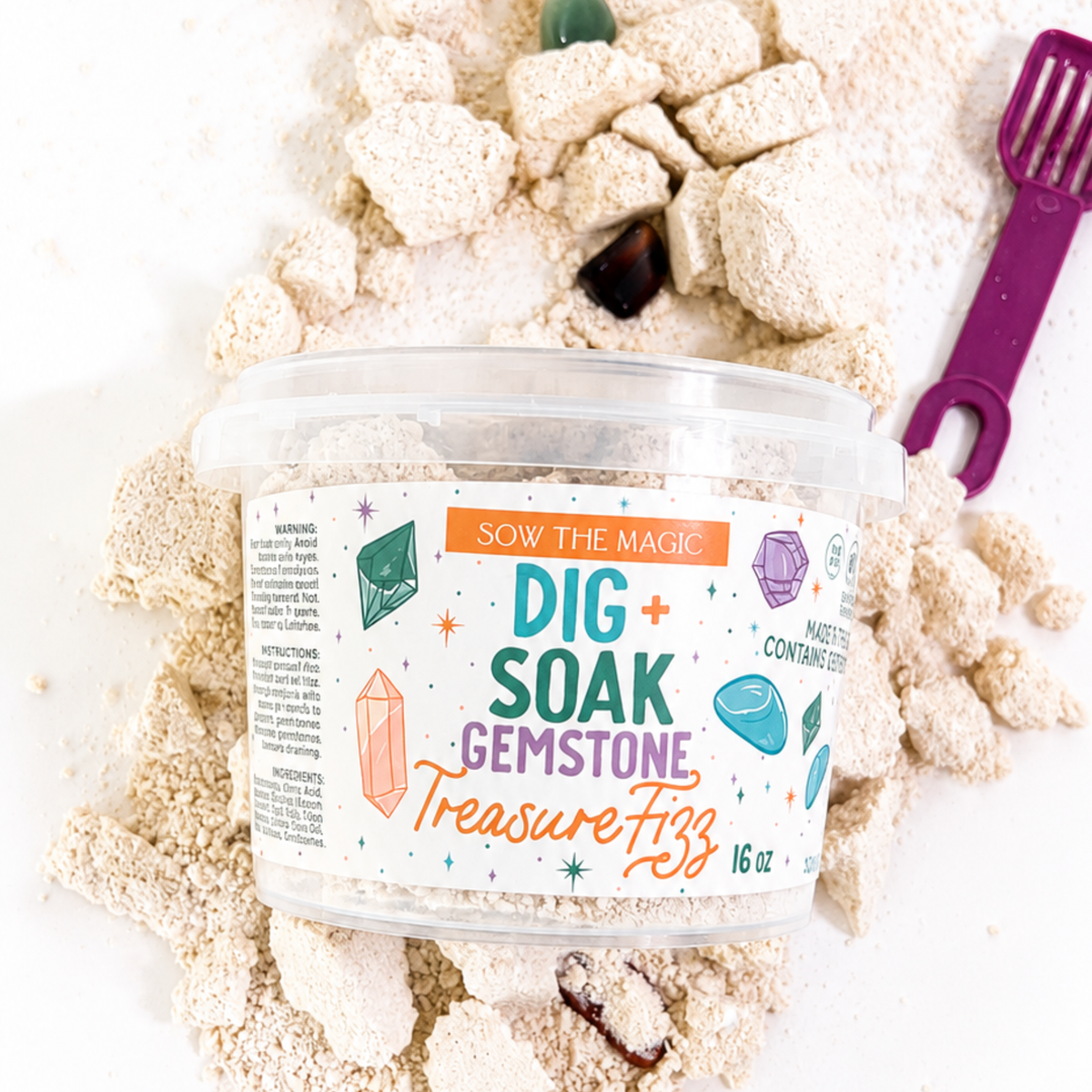 Sow the Magic Dig and Soak Surprise Gemstone Treasure Fizz bucket with purple scoop and loose fizz chunks