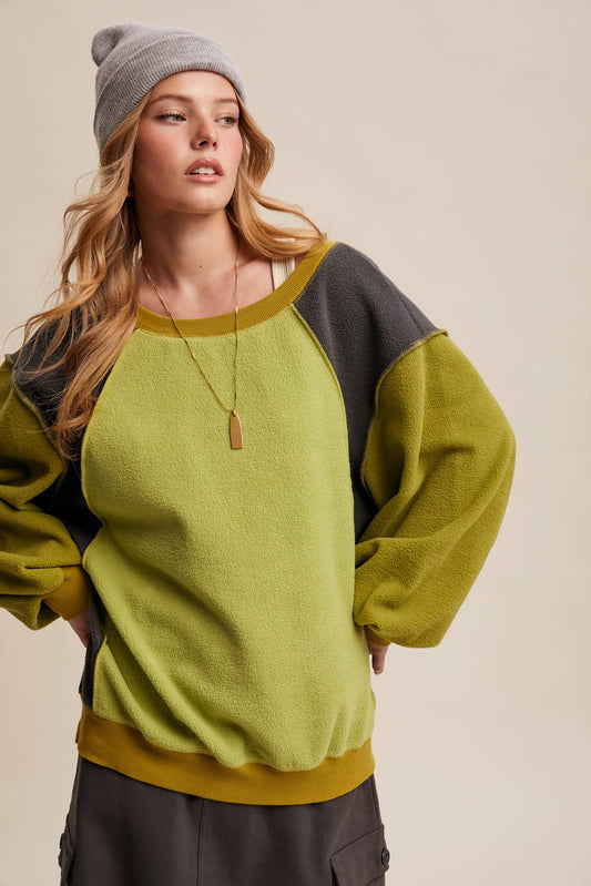 Listicle Colorblock Fleece Pullover LT1111 in green and charcoal with a grey beanie