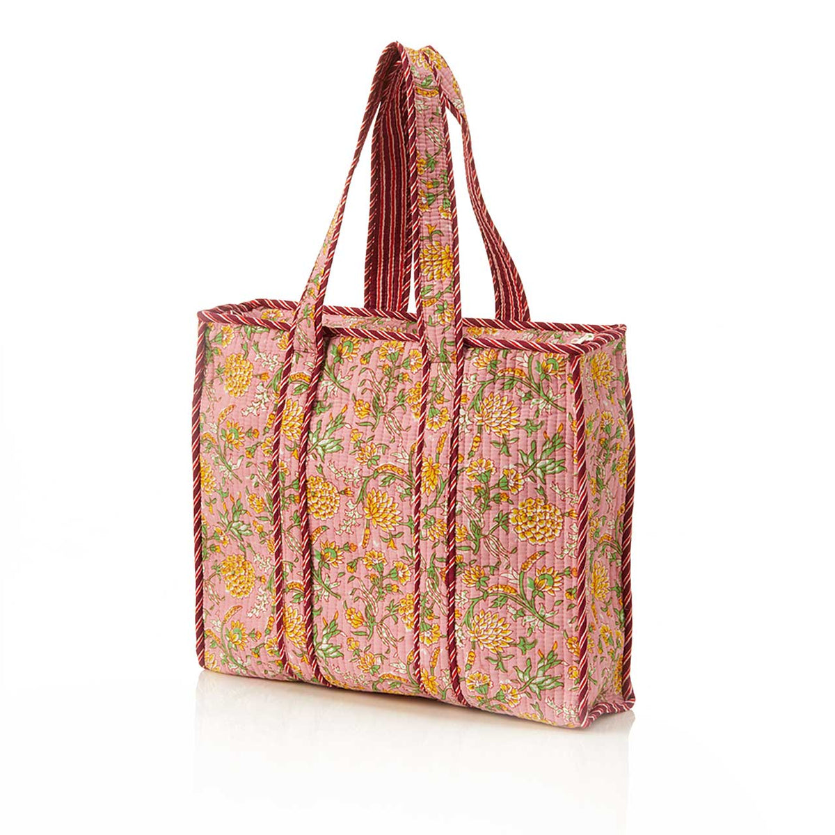 Marigold Blush Quilted Tote Bag by SERRV International with pink floral pattern and striped fabric handles