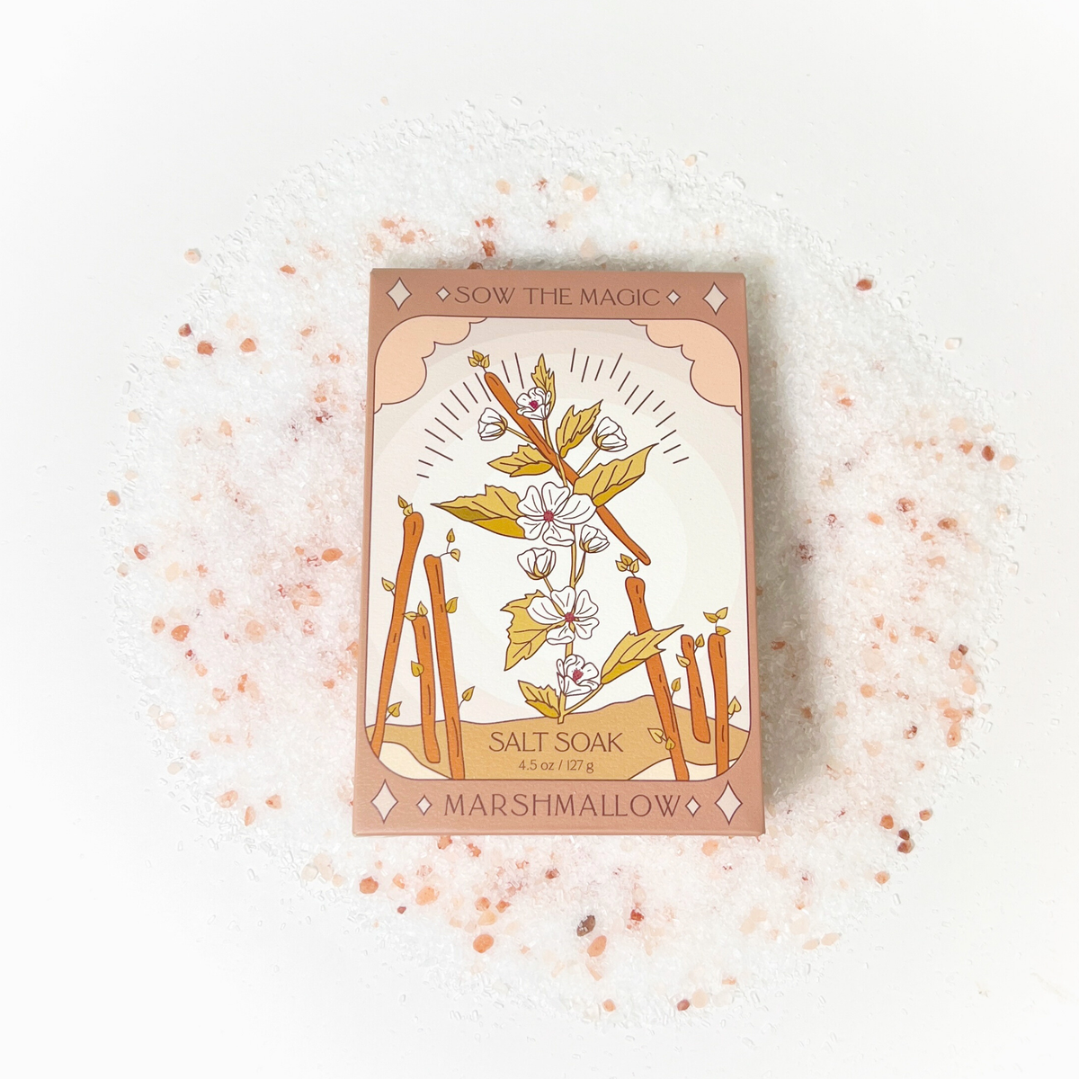 Sow the Magic Marshmallow Tarot Salt Soak box resting on a bed of pink Himalayan salt