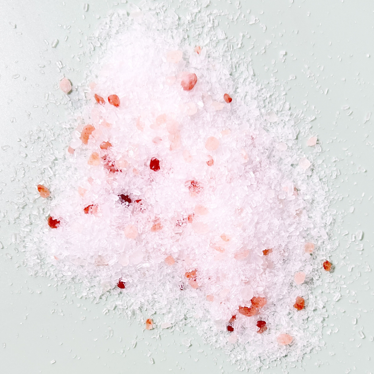 Sow the Magic Rosemary Tarot Salt Soak featuring a pile of white and pink mineral bath salts