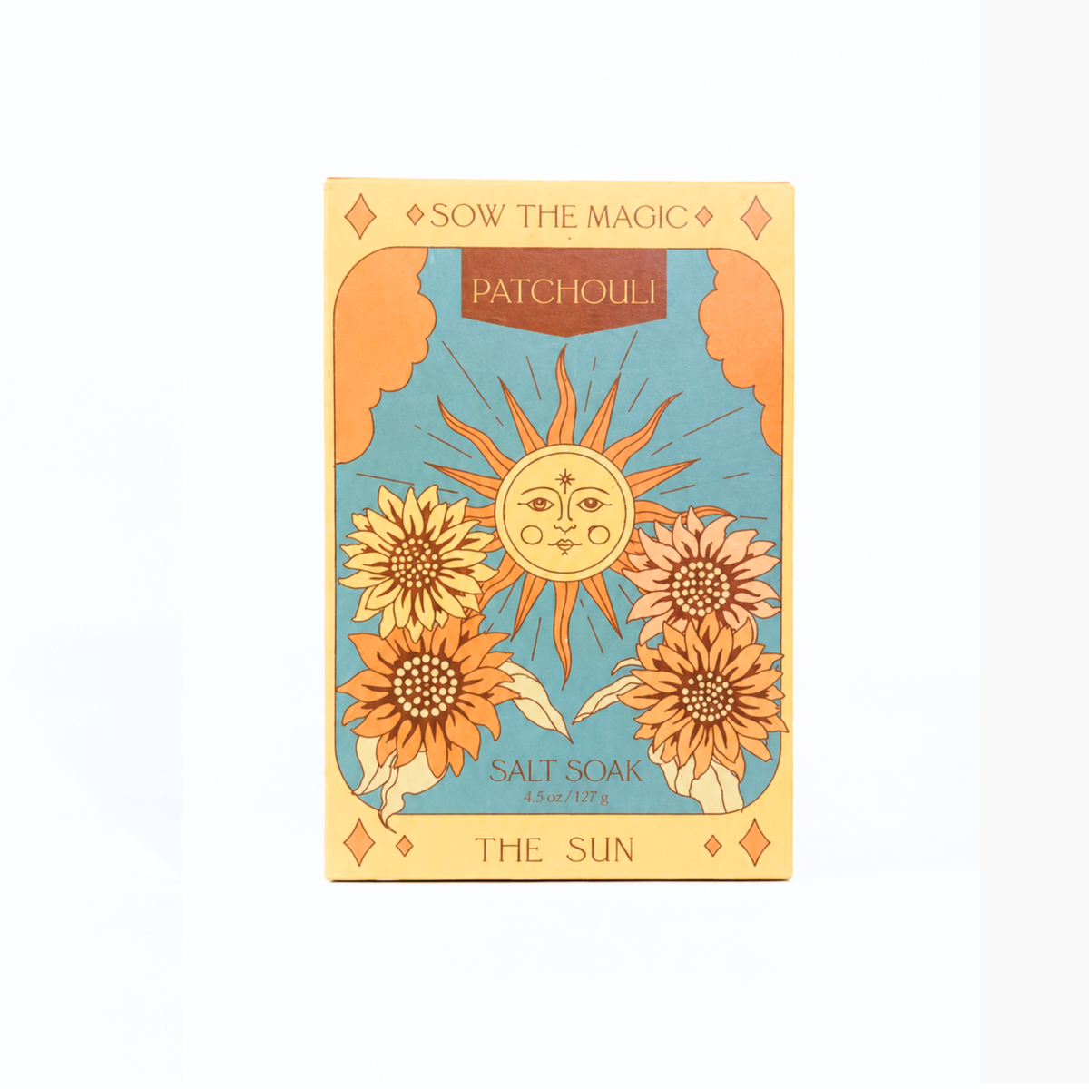 Sow the Magic The Sun salt soak in patchouli packaging with sun and sunflower illustrations