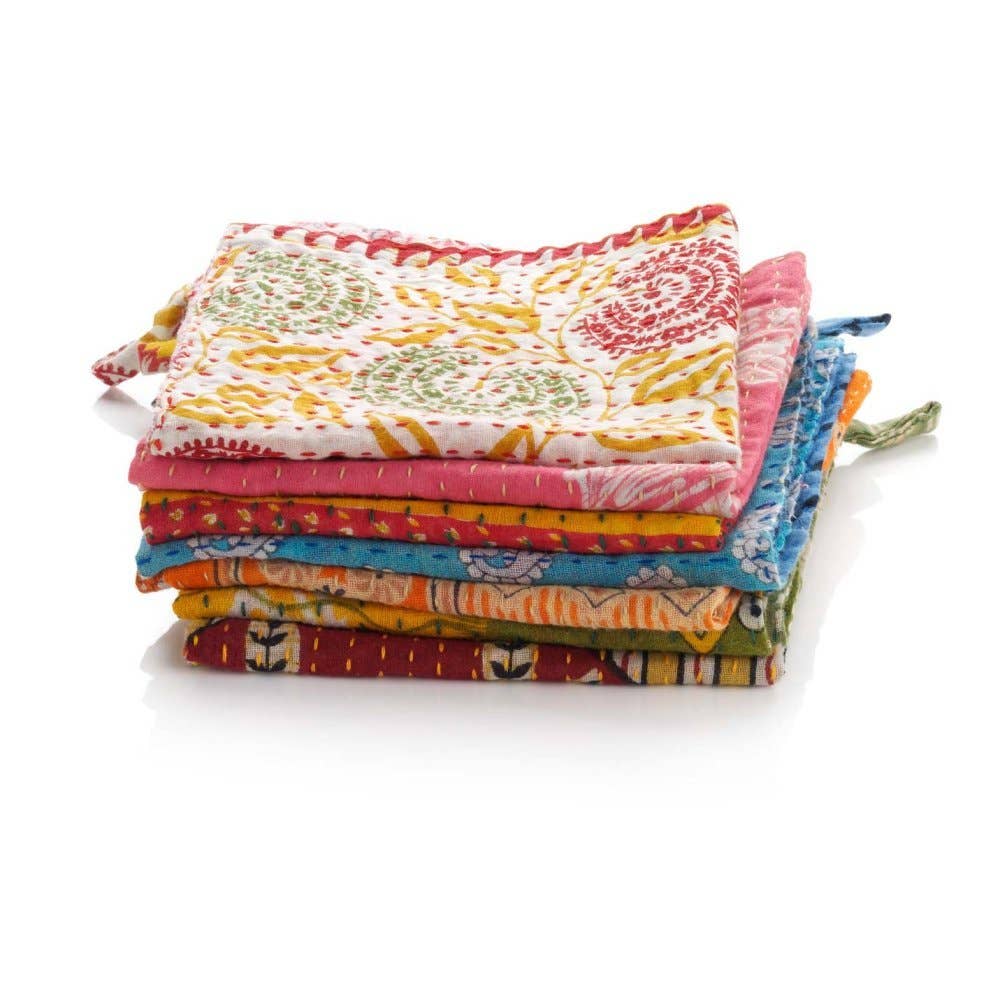 Stack of three SERRV International Kantha dishcloths with colorful floral and geometric patterns