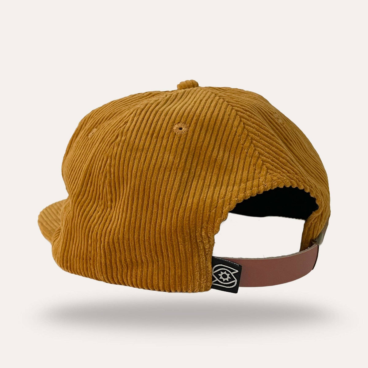 Back view of Sunday Lounge mustard corduroy Mushroom Hat with brown leather strap and brand logo tab