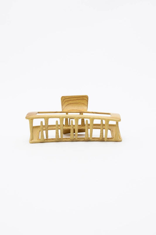 Beige hair clip on a white background