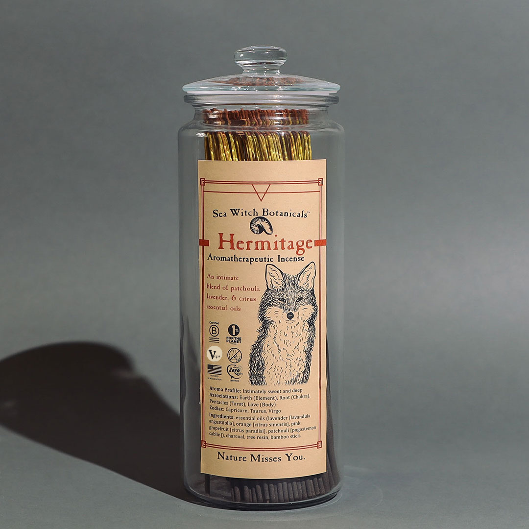 Sea Witch Botanicals Hermitage incense sticks in a glass jar with a fox illustration on the label