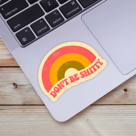 Big Moods Dont Be Shitty rainbow sticker on a laptop