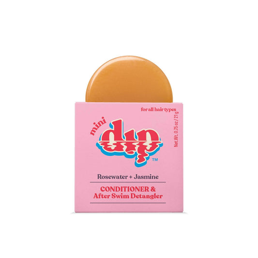 Mini DIP conditioner bar with pink packaging on a white background