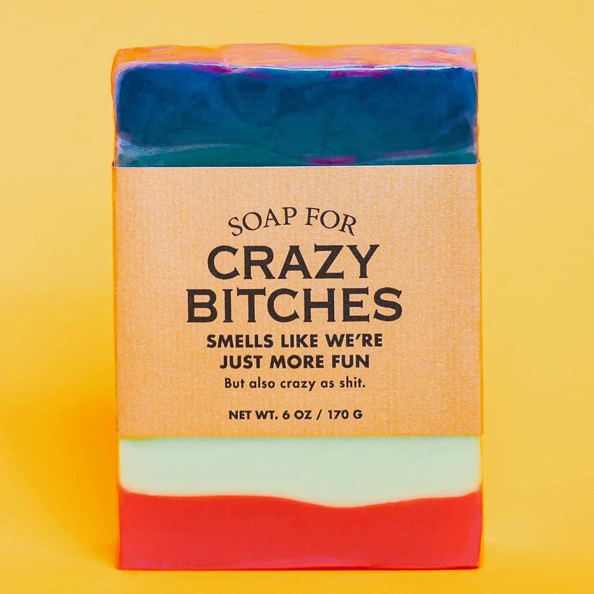 Whiskey River Soap Co Soap for Crazy Bitches bar with orange label on yellow background