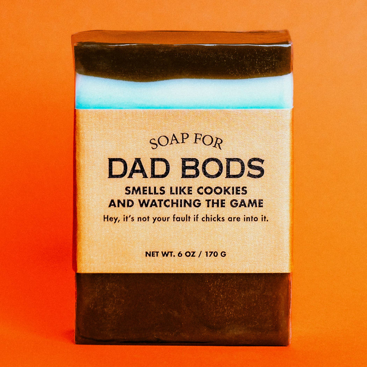 Whiskey River Soap Co Soap for Dad Bods bar with gold label on orange background