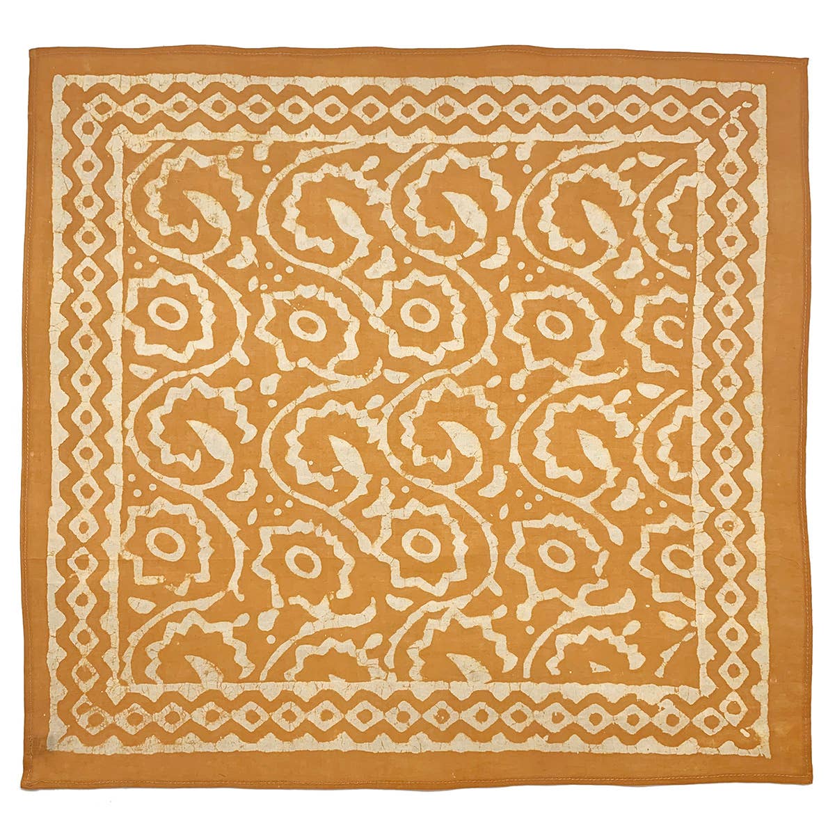 Patterned fabric square with orange and white design on a white background